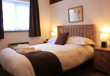 Farriers Cottage master bedroom with smart TV