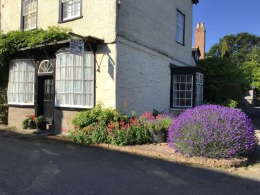 Georgian frontage including historic shop windows.