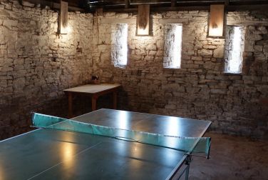 Rustic table tennis in the outbuildings at Monnington House