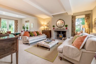The third reception room, the drawing room with comfy sofas, woodburner and card table and chairs