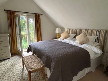 Geiger bedroom in Garden Cottage with lovely views over the garden and playing field