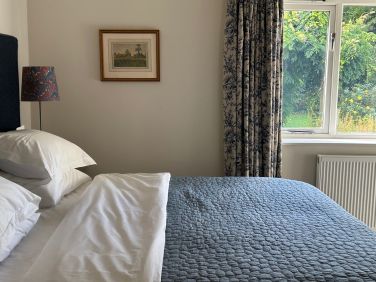 Summer Bough bedroom with lovely views over the south facing garden and terrace