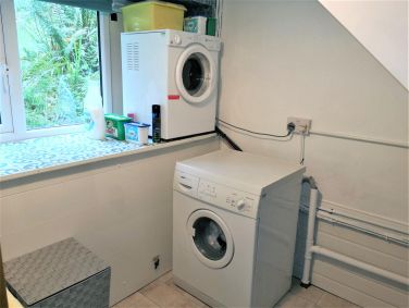 Utility room with washer and dryer