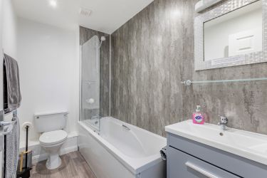 Bath and shower in the good sized bathroom