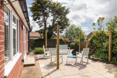 The fully enclosed garden has plenty of seating to relax and soak up the sun or gaze at the stars