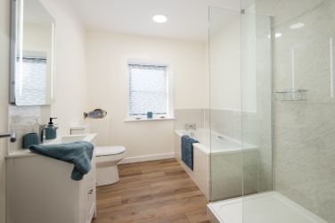 Main bathroom with bath and separate walk-in shower enclosure