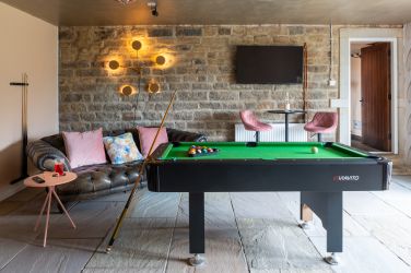 Lounge bar by day-  with sofas, large TV, pool table and karaoke.