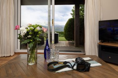 Sliding glass doors framing the panoramic mountain views