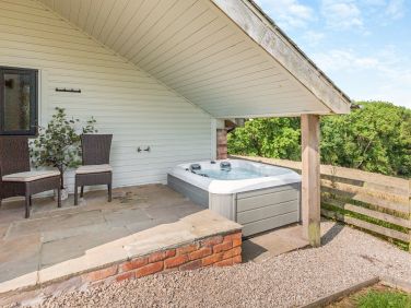 Private hot tub with access directly from bedroom at Cwtch