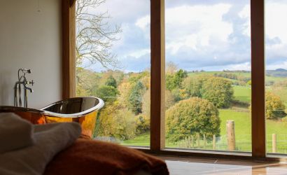 Feature copper bath with a countryside view