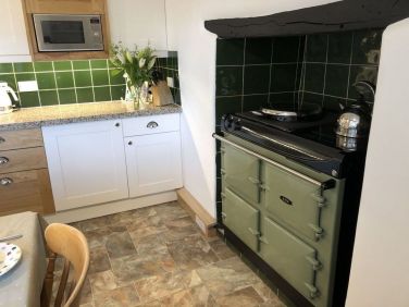 The AGA is the heart of the kitchen. It&rsquo;s electric and super easy to use.
