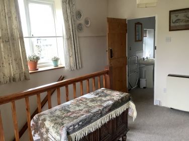 Landing and entrance to bathroom
