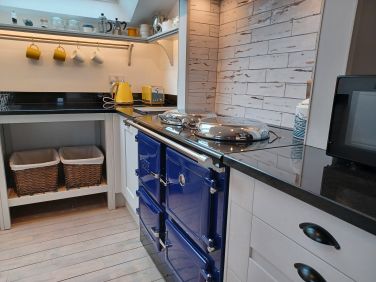 Modern, bright, well equipped kitchen.