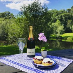 Why not indulge in a champagne cream tea by the lake?
