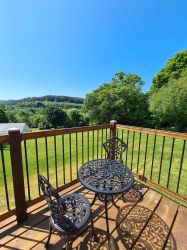 Owl Lodge balcony seating area.