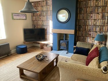 Living room with cosy woodburner
