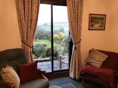 Cedarcroft lounge with view over garden