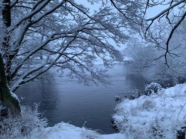 Snowy day by the river