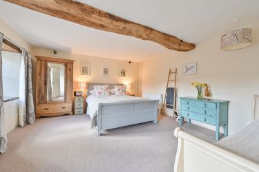 Downstairs large bedroom with King sized double bed and day bed