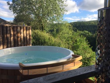 Book the wood fired hot tub for the evening and watch the sun set down the Teign Valley