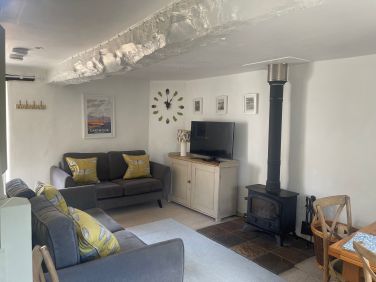 Butterdon's cosy lounge with wood burner