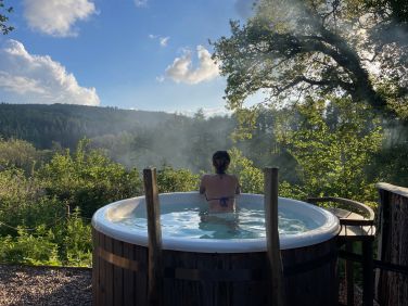 The off gird wood fired hot tub with views down the Teign Valley