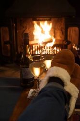 Snug and cosy sitting by the fire in Studio Cottage