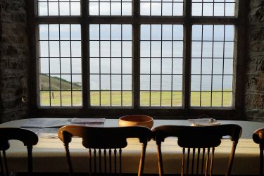 Big dining table overlooking the sea
