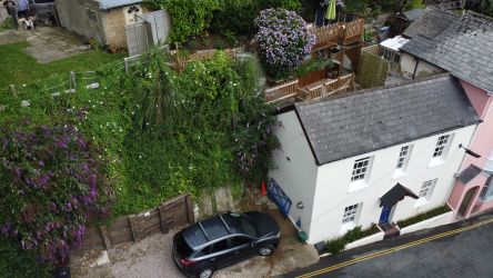The three terraces behind the cottage and dog exercise area