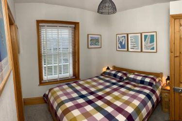 Bedroom 1 with comfortable King Size bed and access to bathroom w/c