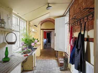 The flower passage between kitchen and red dining room
