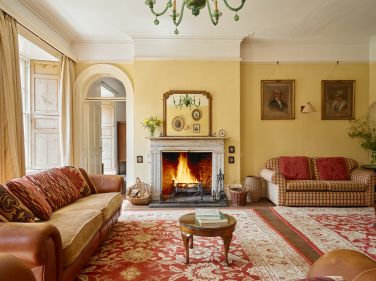 The sitting room with log fire and plenty of seating
