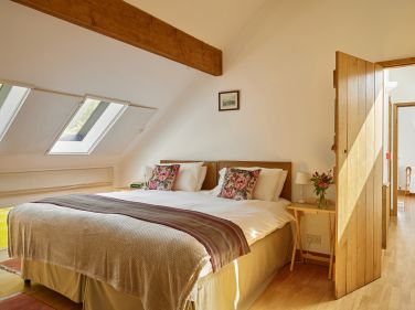 The Hayloft bedroom in the Stables