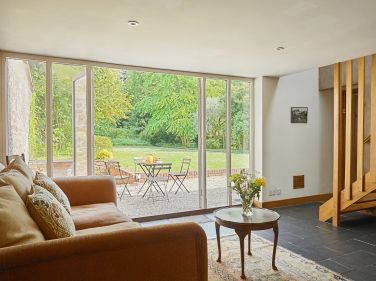 The Stables seating area, looking over the gardens