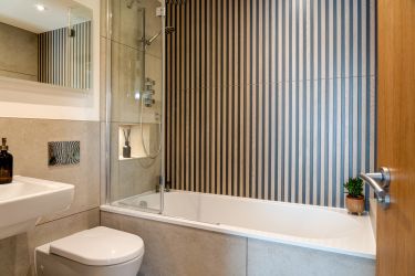 Family bathroom shower over bath