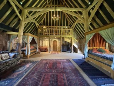 The Tudor barn sleeps 23+ in four bedrooms + the open plan barn - in four posters, doubles, single