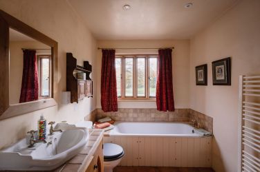 One of two bathrooms with shower (out of view!) + a large modern shower block is accessible to all