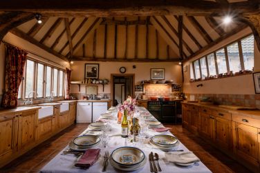 Enjoy tea or a smart dinner party in the barn kitchen for up to 12 -