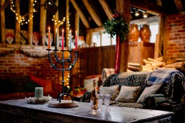 A cosy sitting area around the woodburner seats 23 or so guests