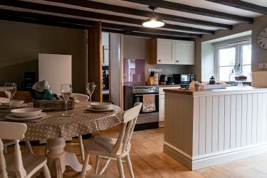 Kitchen dining area with plentiful seating for four people