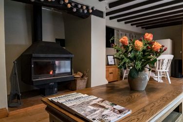 Large inglenook fireplace with log burner