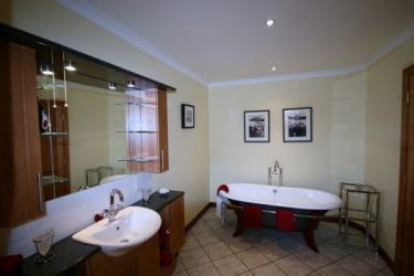 Bathroom with roll top bath