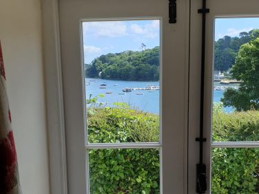 There are stunning views from the sitting room over Helford Creek and the hamlet of Treath.