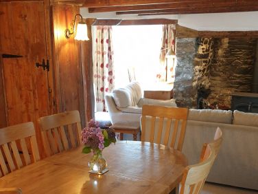 The dining table normally seats 6 people and is able to be extended to fit 8 people if needed.