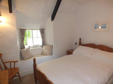 The double bedroom is light and airy and looks out over the front of Laloma.