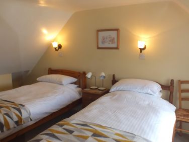 The twin bedroom has stunning creek views.