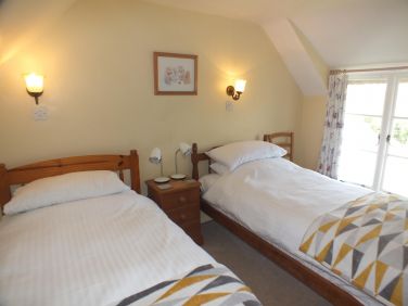 The twin bedroom has stunning creek views.