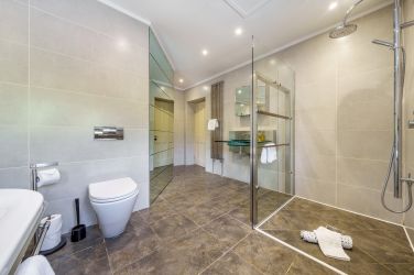 Number One family bathroom with shower cubicle and freestanding bath.