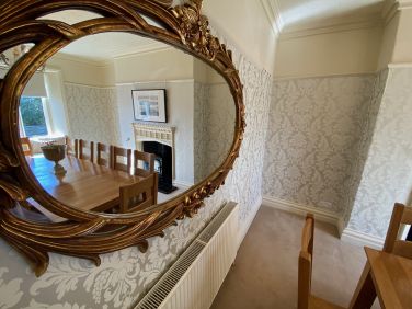 White Moss dining room through mirror.