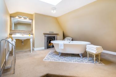 White Moss top floor bathroom with freestanding bath.